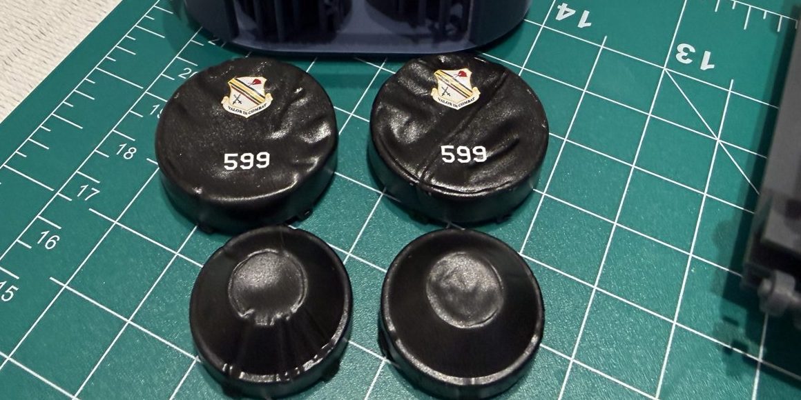 Painted black engine covers with unit crest and 599 markings